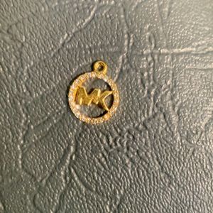 Micheal kors necklace peace gold.